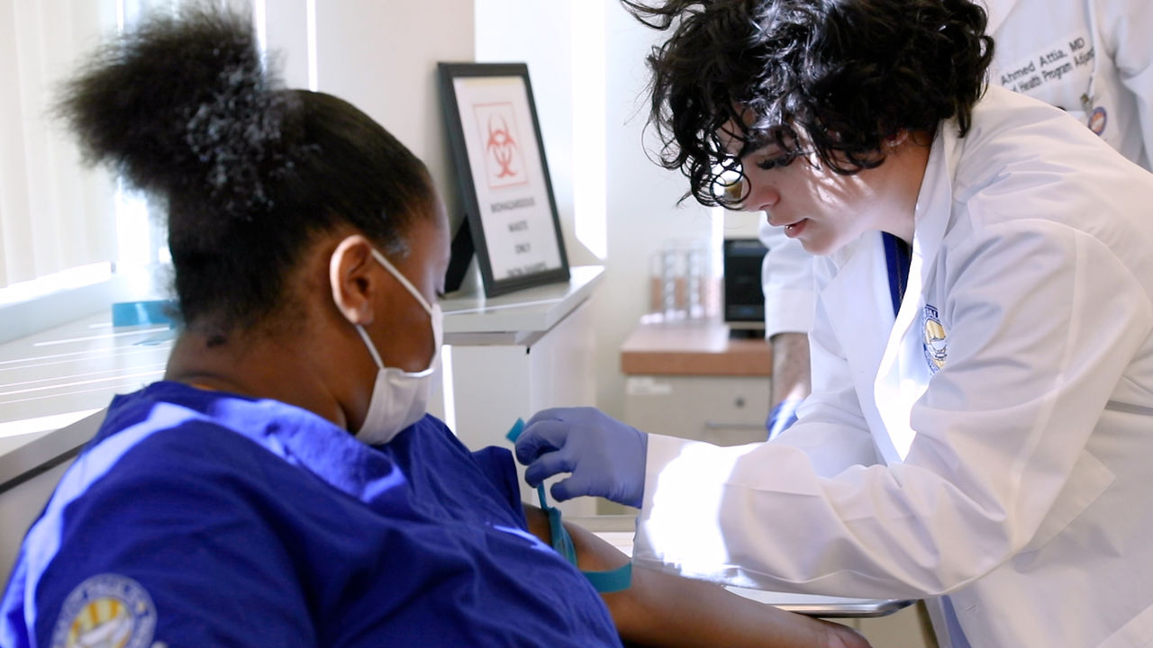 Healthcare worker administering vaccine to patient in clinic