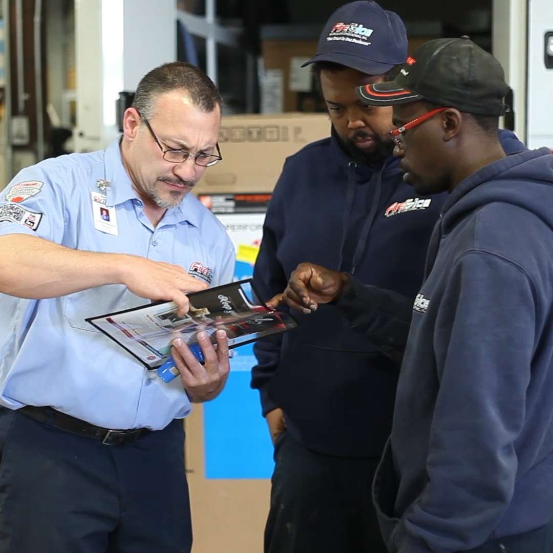 Auto service team discussing product details