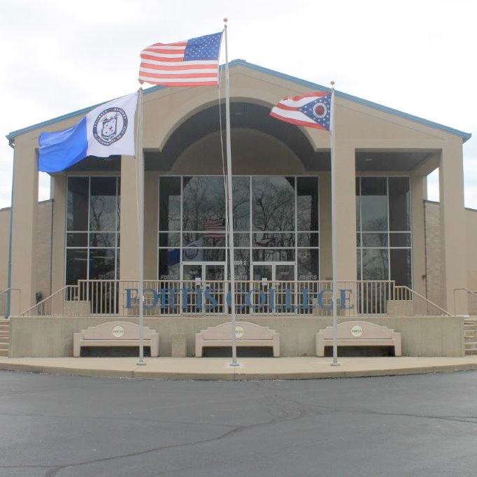 College Building with Three Flags Displayed