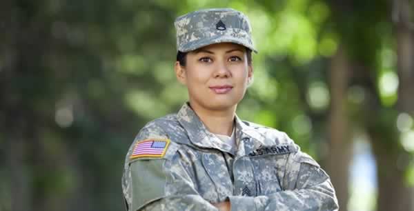Military personnel in camouflage uniform outdoors